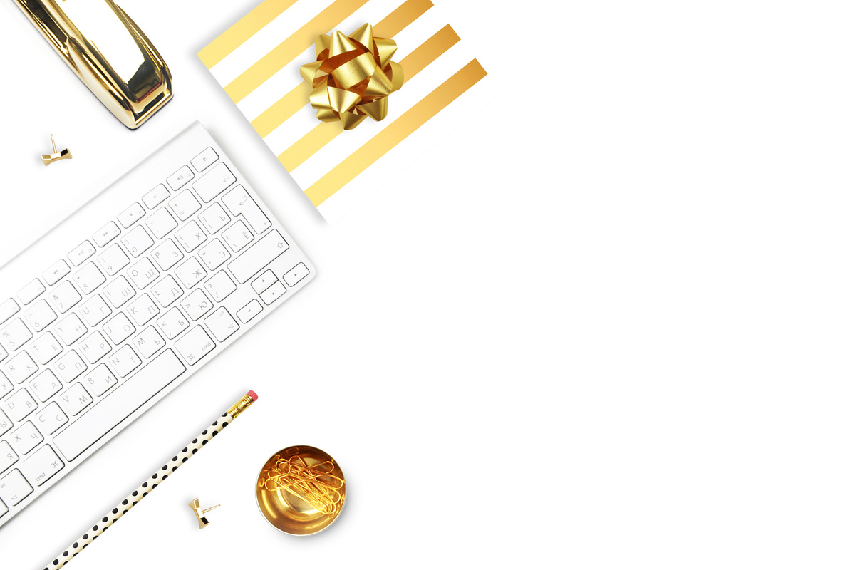 Flat lay, office white desk and keyboard with gold stationery